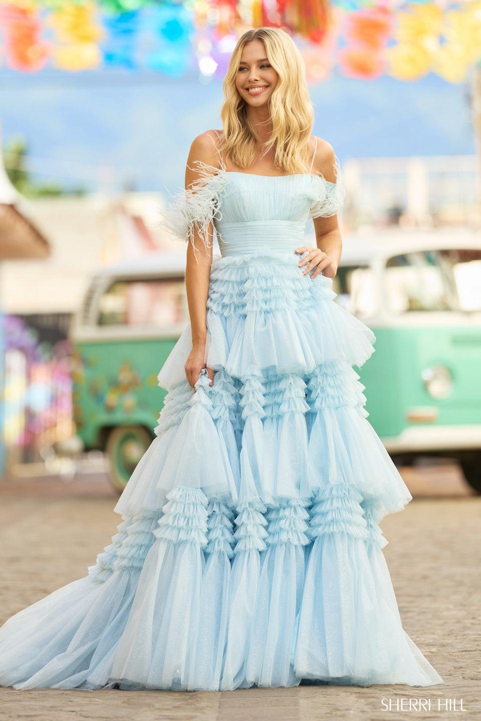 sherri hill Tulle ball gown with tiered ruffle skirt ruched bodice skirt slit and feathers off the shoulder sherri hill Tulle ball gown with tiered ruffle skirt ruched bodice skirt slit and feathers off the shoulder