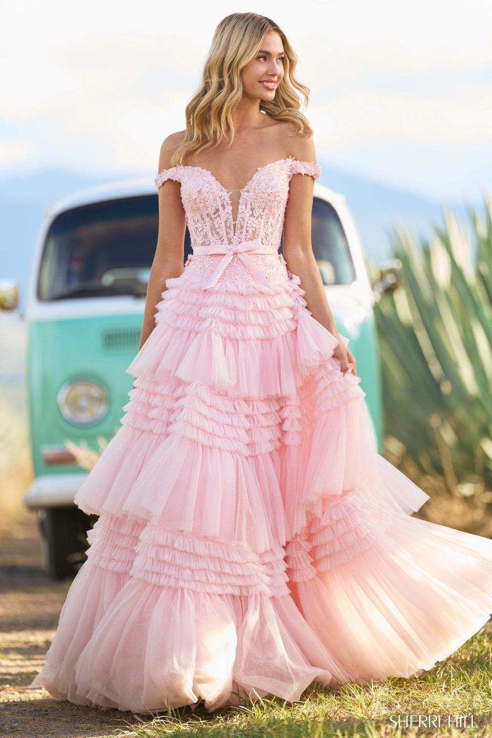 sherri hill Tulle ballgown with tiered ruffle skirt lace corset bodice with bow deep V illusion neckline and off the shoulder sleeves sherri hill Tulle ballgown with tiered ruffle skirt lace corset bodice with bow deep V illusion neckline and off the shoulder sleeves