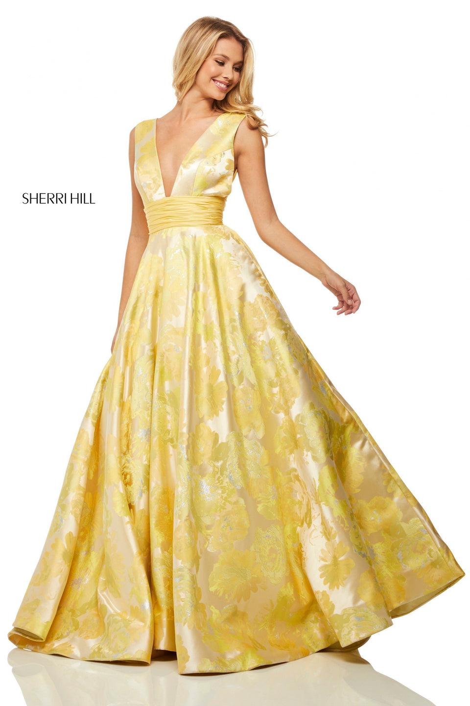 sherri hill Yellow brocade ball gown with a deep-V bodice and sides