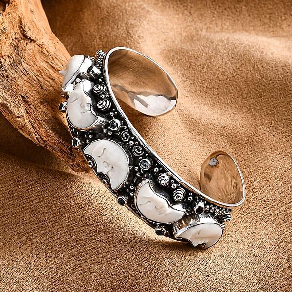 Shop Lc Bali Legacy Carved Bone And Blue Topaz 1.20 Ctw Moon Cuff Bracelet In Sterling Silver (8.00In)
