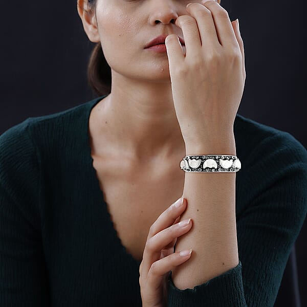 Shop Lc Bali Legacy Carved Bone And Blue Topaz 1.20 Ctw Moon Cuff Bracelet In Sterling Silver (8.00In)