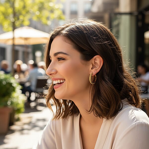 Shop Lc Criss Cross Hoop Earrings In ION Plated YG Stainless Steel