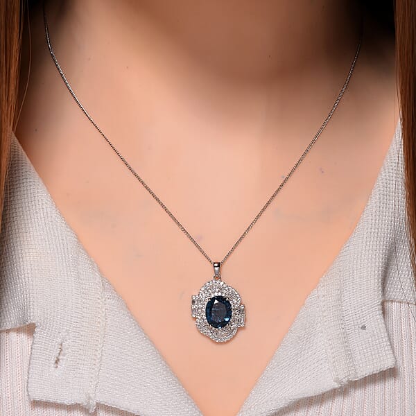 Shop Lc D'Joy Indigo Kyanite And Moissanite 5.25 Ctw Swirl Halo Pendant Necklace In Rhodium Over Sterling Silver 20 Inches