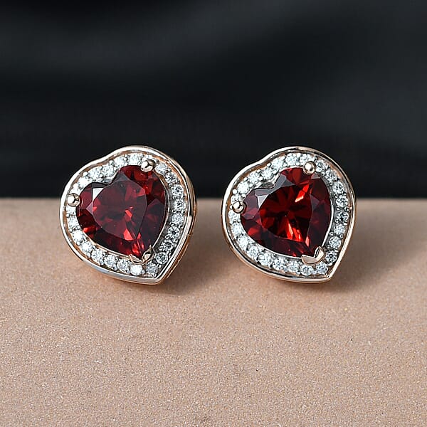 Shop Lc D'Joy Mozambique Garnet And Moissanite 3.00 Ctw Heartfire Glow Earrings In 18K Vermeil Rose Gold Over Sterling Silver