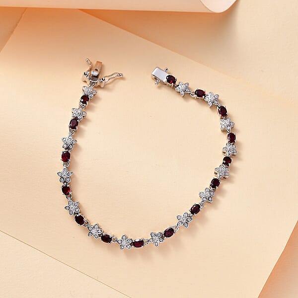 Shop Lc D'Joy Premium Anthill Garnet And Moissanite 5.30 Ctw Flower Bracelet In Rhodium Over Sterling Silver (7.25 In)
