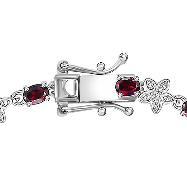 Shop Lc D'Joy Premium Anthill Garnet And Moissanite 5.30 Ctw Flower Bracelet In Rhodium Over Sterling Silver (7.25 In)
