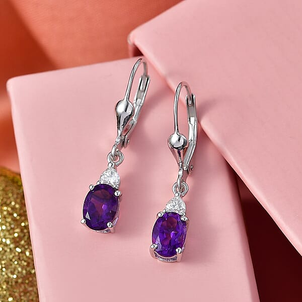 Shop Lc D'Joy Premium Lusaka Amethyst And Moissanite 1.65 Ctw Heart Accent Earrings In Rhodium Over Sterling Silver