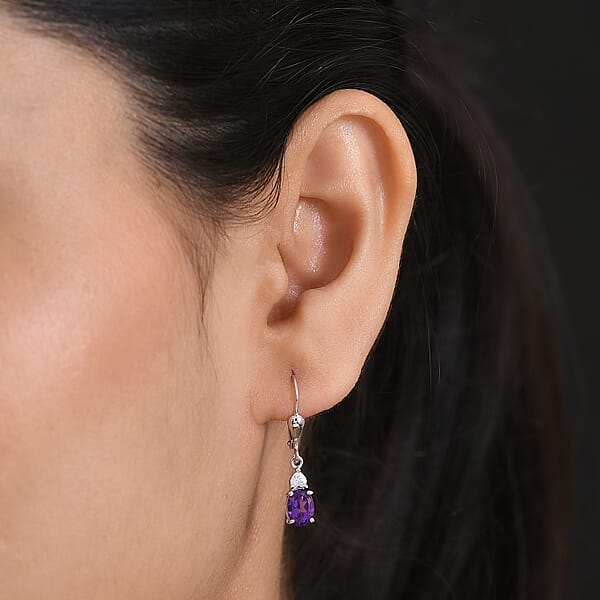 Shop Lc D'Joy Premium Lusaka Amethyst And Moissanite 1.65 Ctw Heart Accent Earrings In Rhodium Over Sterling Silver