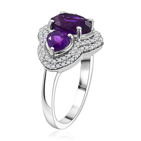Shop Lc D'Joy Premium Lusaka Amethyst And Moissanite 3.00 Ctw Trilogy Ring In Rhodium Over Sterling Silver