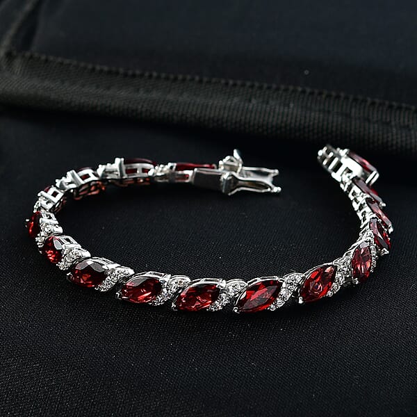 Shop Lc D'Joy Premium Mozambique Garnet And White Zircon 22.00 Ctw Passion Wave Bracelet In Rhodium Over Sterling Silver (7.25 In)