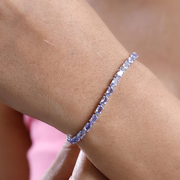 Shop Lc D'Joy Tanzanite 6.15 Ctw Tennis Bracelet In Rhodium Over Sterling Silver (7.25 In)