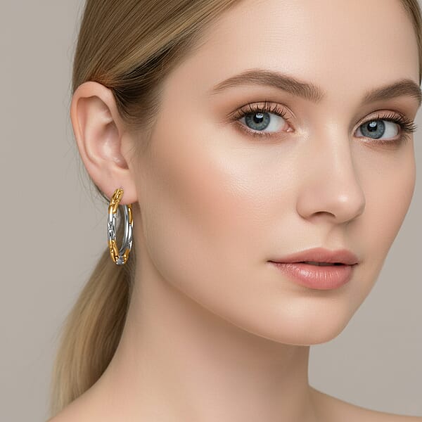 Shop Lc Hammered Hoop Earrings In ION Plated YG Stainless Steel