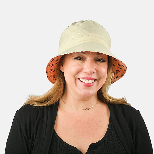 Shop Lc ShedRain Cream And Orange Floral Reversible Bucket Hat