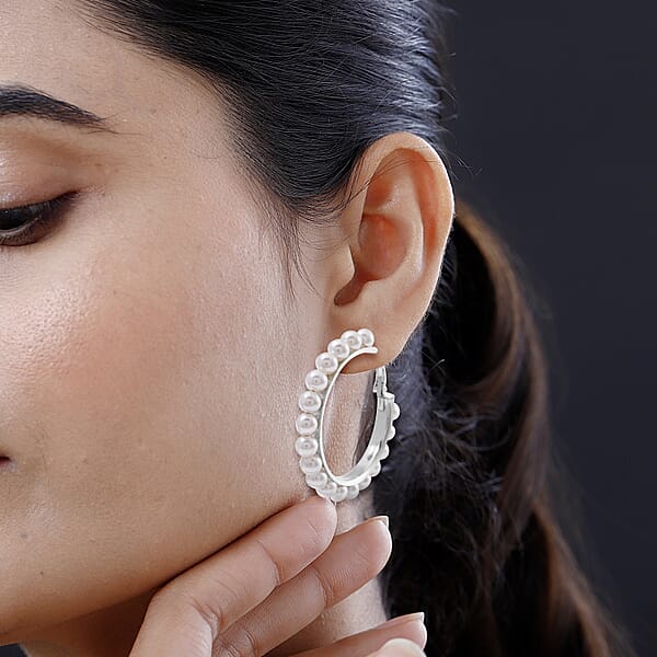 Shop Lc White Shell Pearl Hoop Earrings In Stainless Steel
