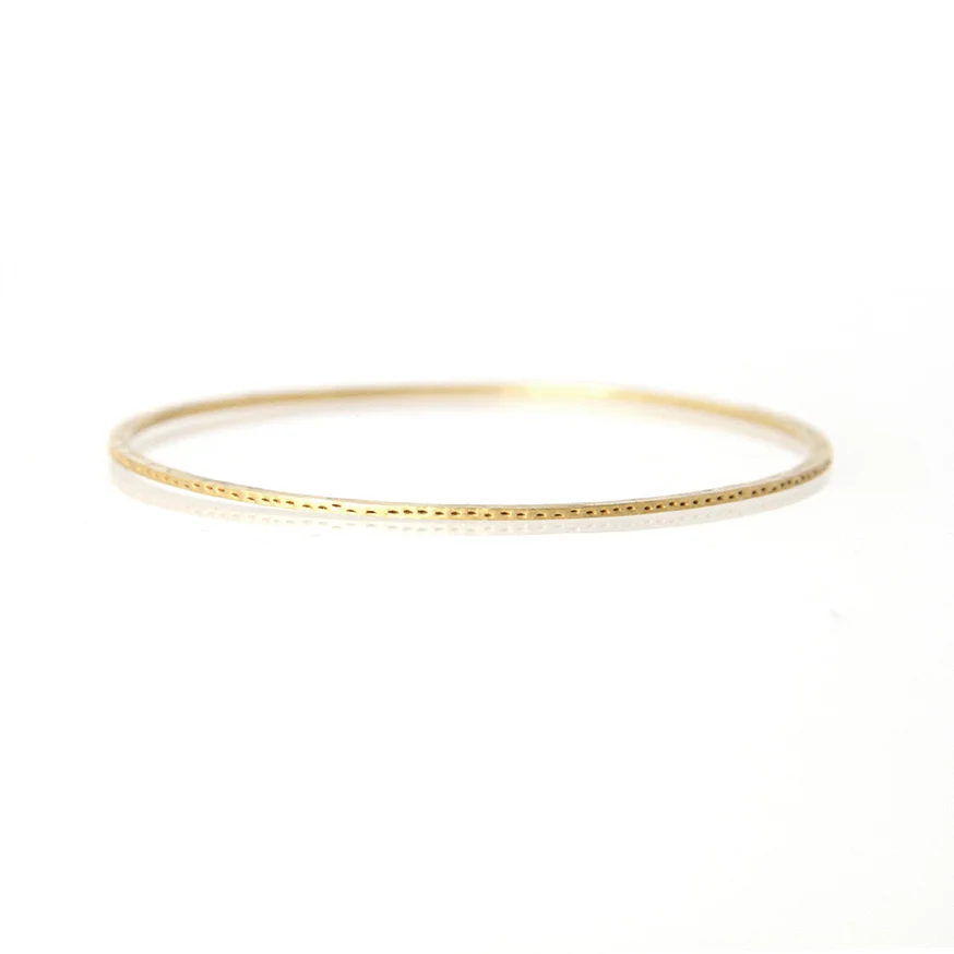 sian evans jewellery textured thin recycled 18ct gold bangle with patterned edge