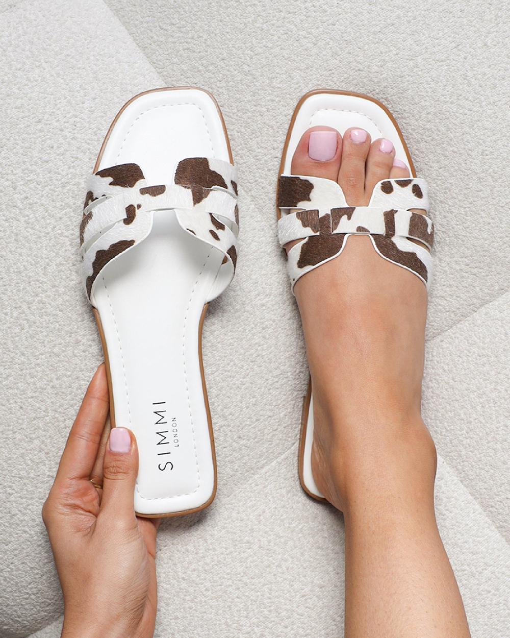 simmi Cow Print Slip On Flat Sandals