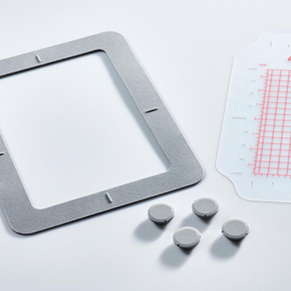 Singer HUSQVARNA® VIKING® DESIGNER TOPAZ™ 40 Sewing & Embroidery Machine Bundle