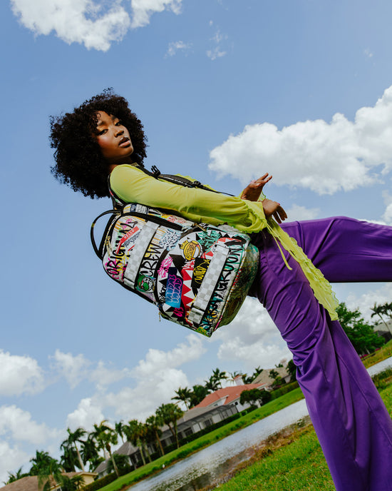 Sprayground CREATE ANOTHER DAY SKATEBOARD-STRAP BACKPACK