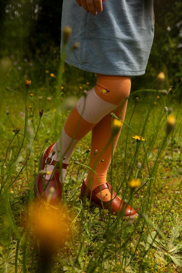 sticky lemon over the knee socks | wanderer | faded orange + candy pink