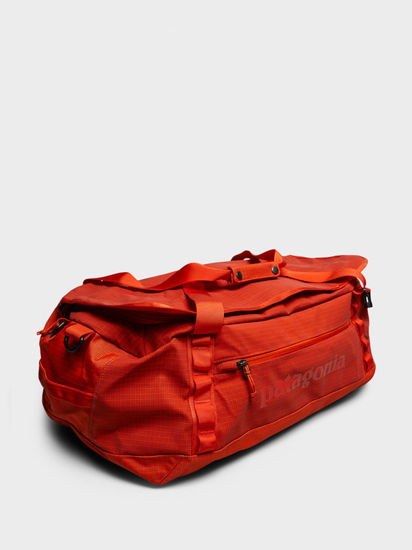 Stoy Black Hole Duffel 40L Bag In Pollinator Orange
