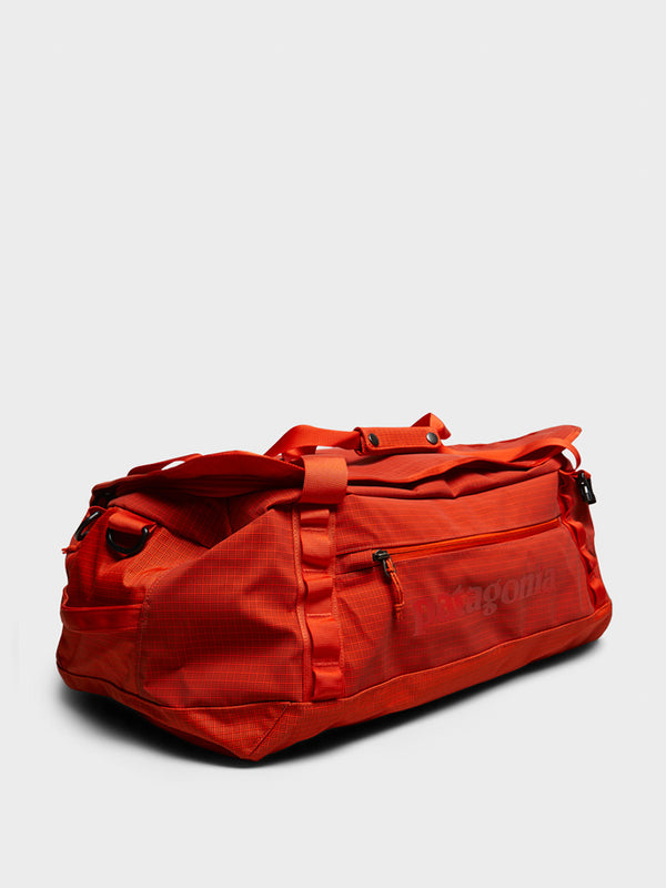 stoy Black Hole Duffel 40L Bag in Pollinator Orange