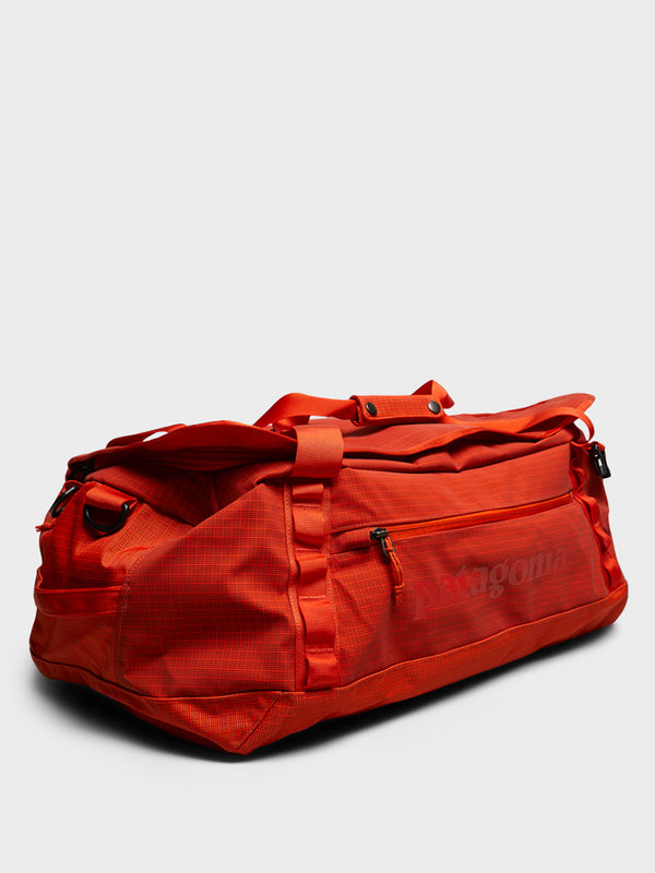 stoy Black Hole Duffel 55L Bag in Pollinator Orange