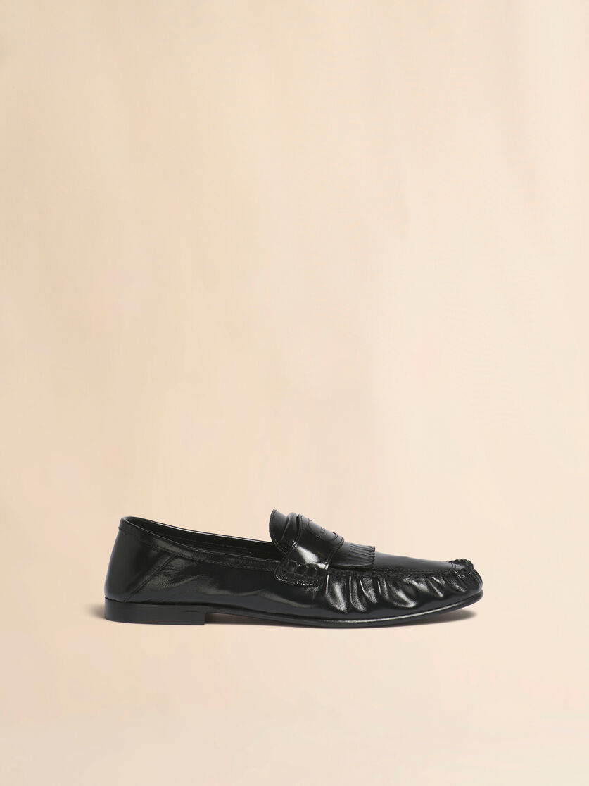 stutterheim x marni Black leather tassel loafer with collapsible heel