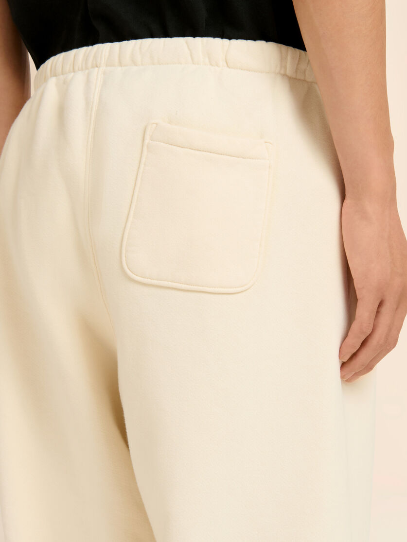 Stutterheim X Marni Marni + Madhappy Cream Cotton Sweatpants With Arch Logo Print