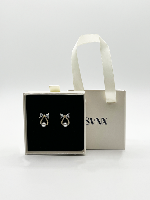svnx Studded Bow Earrings with Hanging Pearl in Gold - Gift Boxed