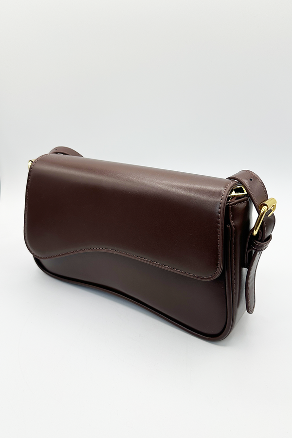 svnx Curved Baguette Bag in Dark Brown