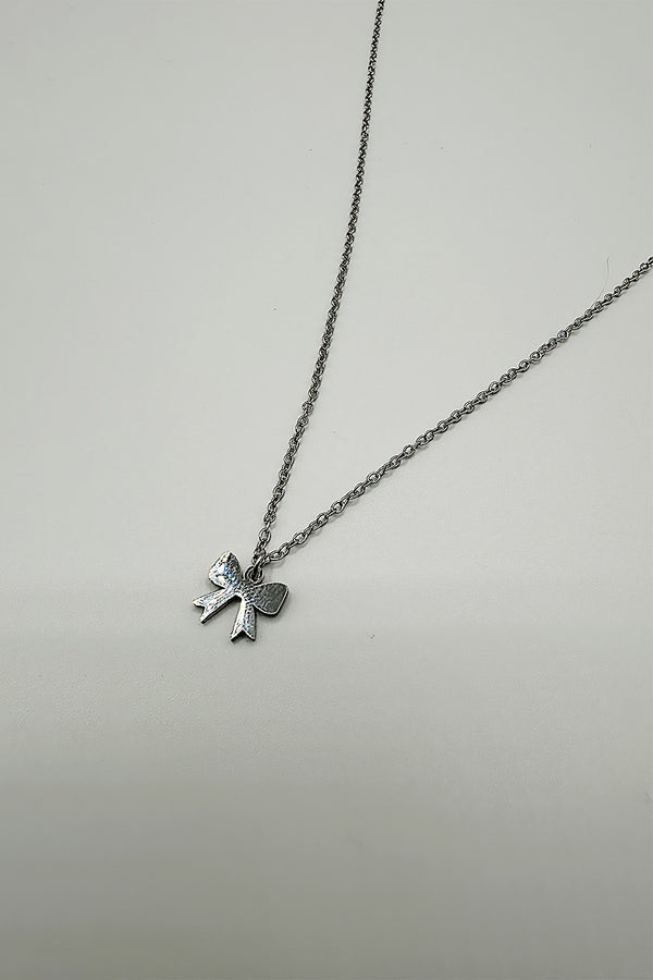 Svnx Mini Bow Pendant Necklace In Silver