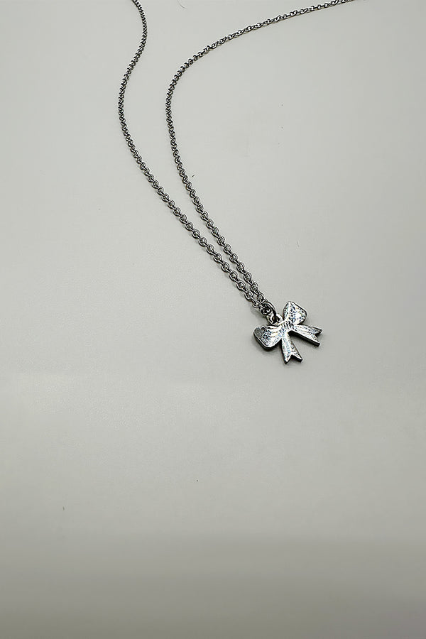Svnx Mini Bow Pendant Necklace In Silver
