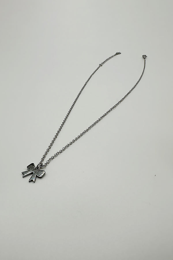 svnx Mini Bow Pendant Necklace in Silver
