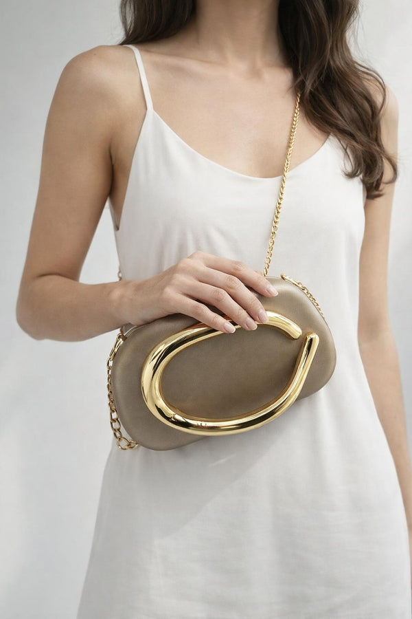 Svnx Oval Satin Hard Case Clutch Bag In Muted Gold