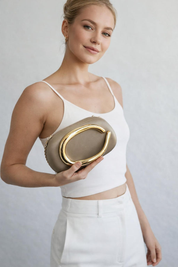 svnx Oval Satin Hard Case Clutch Bag In Muted Gold