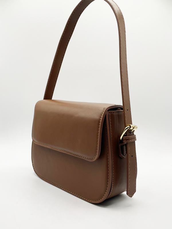 Svnx Rounded Cross Body Bag In Brown