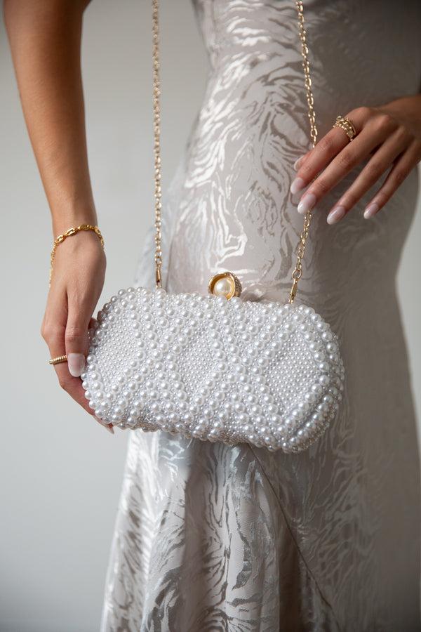 svnx White Pearl beaded clutch bag